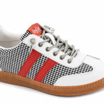 Black and white houndstooth sneakers with red accents and interchangeable laces.