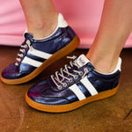 Navy metallic Corky's sneakers with white side stripes and lace-up closure.