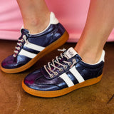 Navy metallic Corky's sneakers with white side stripes and lace-up closure.