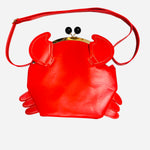 Cherry red crab shaped crossbody bag with claw details and kiss lock closure.