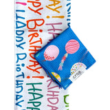 Crae birthday towel set with colorful Happy Birthday lettering and blue balloon-print washcloth.