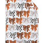 Crae White double-sided hand towel with orange, black, and white game day bow pattern.