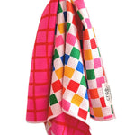 Reversible hot pink and geometric patterned waffle weave microfiber hand towel for kitchen or bathroom