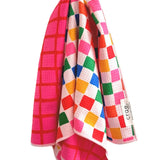 Reversible hot pink and geometric patterned waffle weave microfiber hand towel for kitchen or bathroom