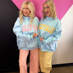 Blue reversible sweatshirt with yellow DILLY DALLY and pink LOLLY GAG lettering.