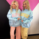 Blue reversible sweatshirt with yellow DILLY DALLY and pink LOLLY GAG lettering.