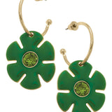Green flower drop hoop earrings with rhinestone accents and shiny gold-tone finish.