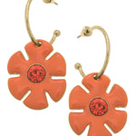 Orange flower drop hoop earrings with rhinestone accents and shiny gold-tone finish.