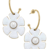 White flower drop hoop earrings with rhinestone accents and shiny gold-tone finish.