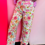 Watercolor floral wide leg pants with patch pockets and button front closure