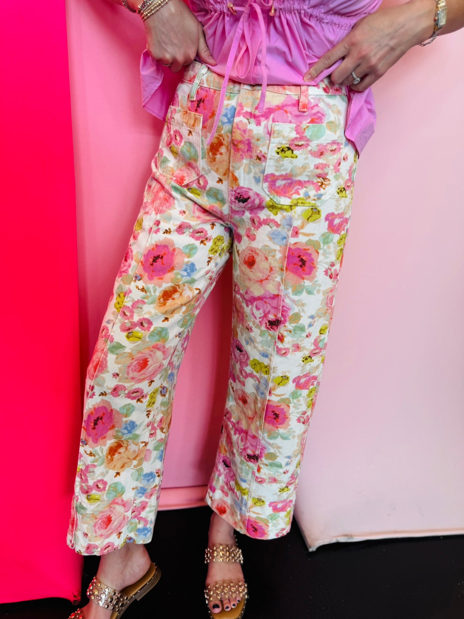 Watercolor floral wide leg pants with patch pockets and button front closure