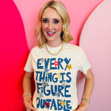 Ivory Everything Is Figureoutable tee with blue graphic and star accents.