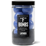Jar of purple F Bath Bombs with lavender scent, loofah, and hidden calming messages inside.