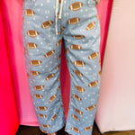 Football print barrel jogger pants with drawstring waist and star accents.