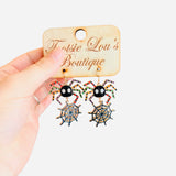 spider dangle earrings, metal colorful spider legs, web hanging down 