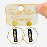 Gold hoops with black dangles and gold writing that says Bearcats set on gold glitter stud