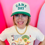 Green Game Day baseball cap with raised embroidered lettering and adjustable strap