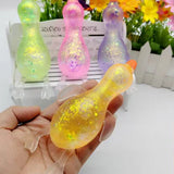 Glitter-filled translucent duck squishy toy in assorted colors.