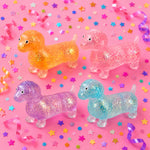 Glitter-filled weenie dog squishy stress toy with sparkling sensory design.