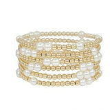 Gold beaded stretch bracelet with pearl accents, water resistant design.