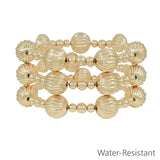Gold beaded bracelet set with textured 14mm beads and smaller accents, water resistant and lead safe.
