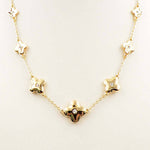 Gold pointed clover rhinestone necklace on adjustable 16 to 18 inch gold chain.
