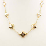 Gold pointed clover rhinestone necklace on adjustable 16 to 18 inch gold chain.