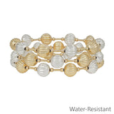 Three gold and silver 10mm textured beaded stretch bracelets, water resistant and stacked together.