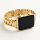 Golden Glamour Apple Watch strap with polished gold-tone curved stainless steel links.