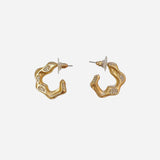 Matte gold wave-shaped hoops accented with tiny sparkling crystals.