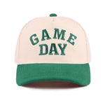 Green Game Day baseball cap with raised embroidered lettering and adjustable strap
