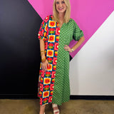 Green colorblock midi dress with mixed floral geometric and white polka dot prints.