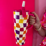 40oz colorful checkered tumbler with flip straw lid and handle.