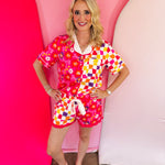 Floral and checkerboard pajama set with ruffle shorts and side pockets.