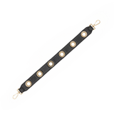 Hammitt black pebbled leather handbag strap with shiny gold grommet detailing, measuring 21 inches long.