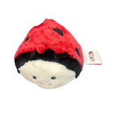 Ladybug Warmies® plush with red body, black spots, microwavable, lavender-scented, and weighted for comfort, safe for all ages.