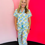 Classic button-down lounge top in soft, stretchy fabric with relaxed fit, contrast piping, and short sleeves.