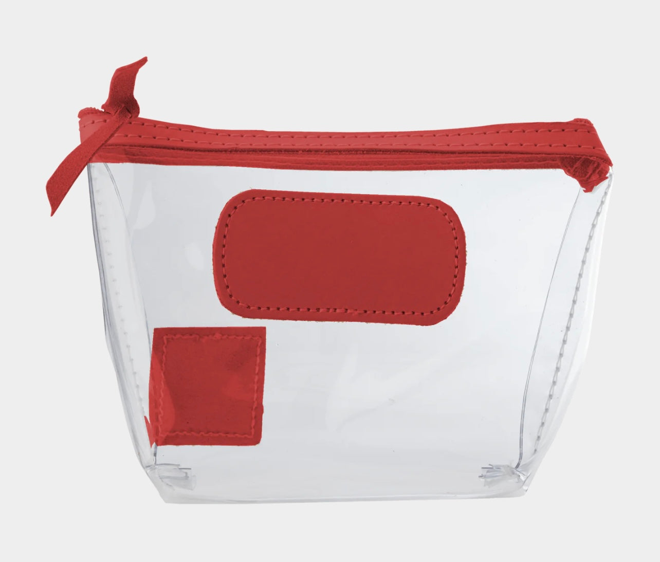 Jon Hart Airport Chico clear TSA-compliant travel pouch with cherry Natural Leather trim, flat bottom, and zippered brass closure—perfect for carrying 3oz liquids and travel essentials.