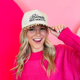 Zenana White cap with black “Blondes Have More Fun” embroidery and leopard-print bill, adjustable strap.