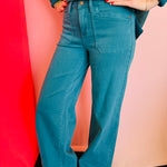 Teal Judy Blue wide-leg jeans with high rise, clean hem, and classic pockets.