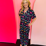 Navy button down pajama set with colorful turquoise, pink, and orange tigers.