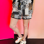 Patchwork print shorts with zebra, leopard, and black and white polka dots, drawstring waist and relaxed fit