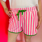 Pink and white striped shorts with bright green piping, relaxed fit, and soft stretchy fabric