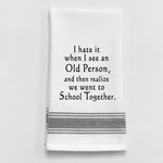 White tea towel with black trim and funny aging school quote.