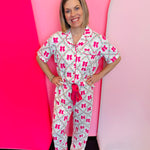 Floral lattice bow pajama set with ruffle trim and button-up top.