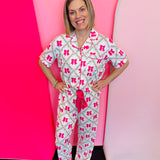 Floral lattice bow pajama set with ruffle trim and button-up top.