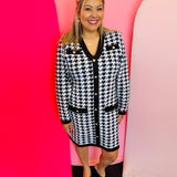 Jess Lea Houndstooth sweater dress with gold buttons, v-neckline, black trim, and front pockets.