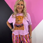 Rose cropped tee with cheetah graphic wearing colorful sparkling statement necklaces.