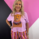 Rose cropped tee with cheetah graphic wearing colorful sparkling statement necklaces.