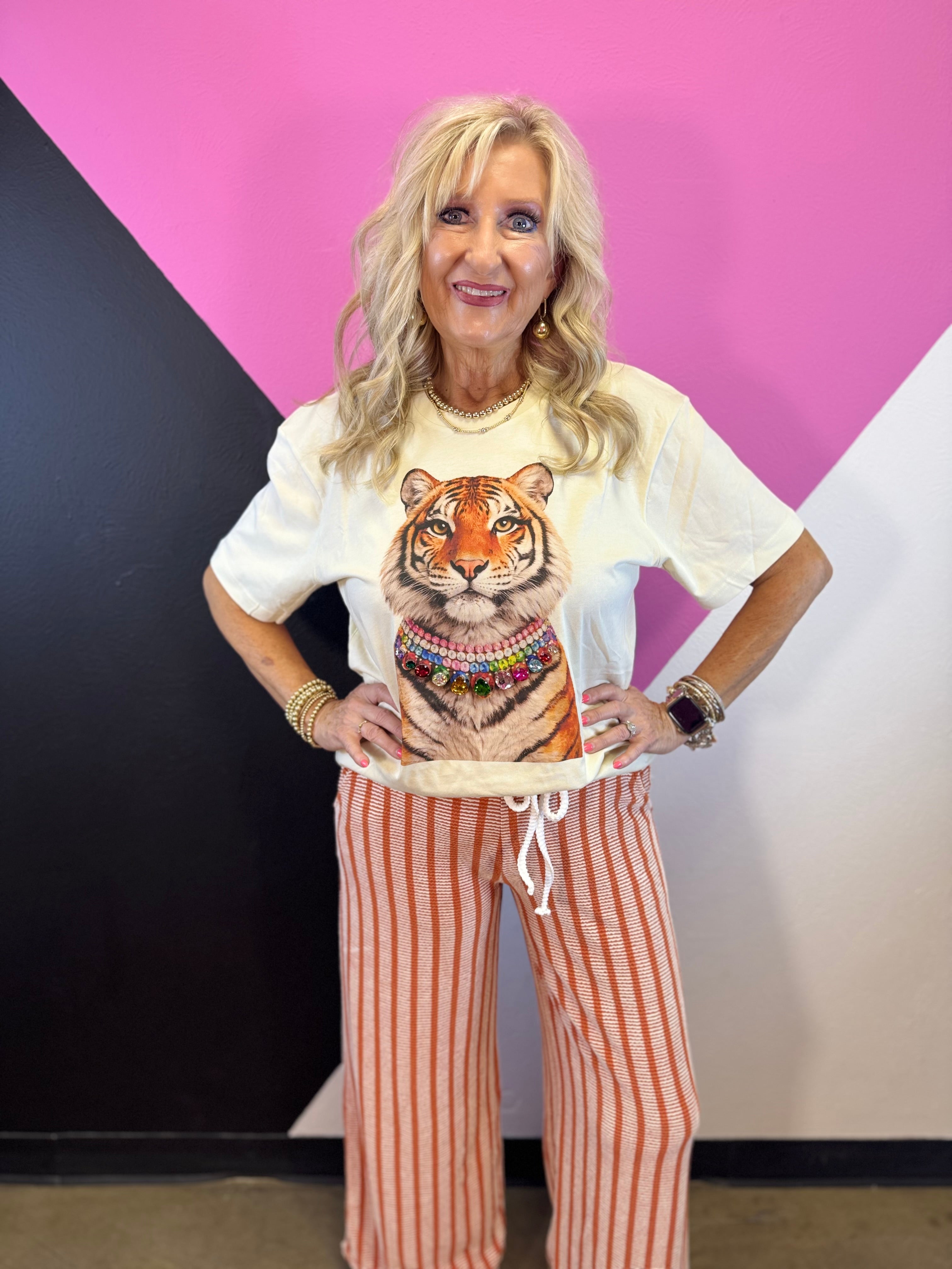 Natural tiger graphic tee with layered necklace design and sparkling multicolored jewels.